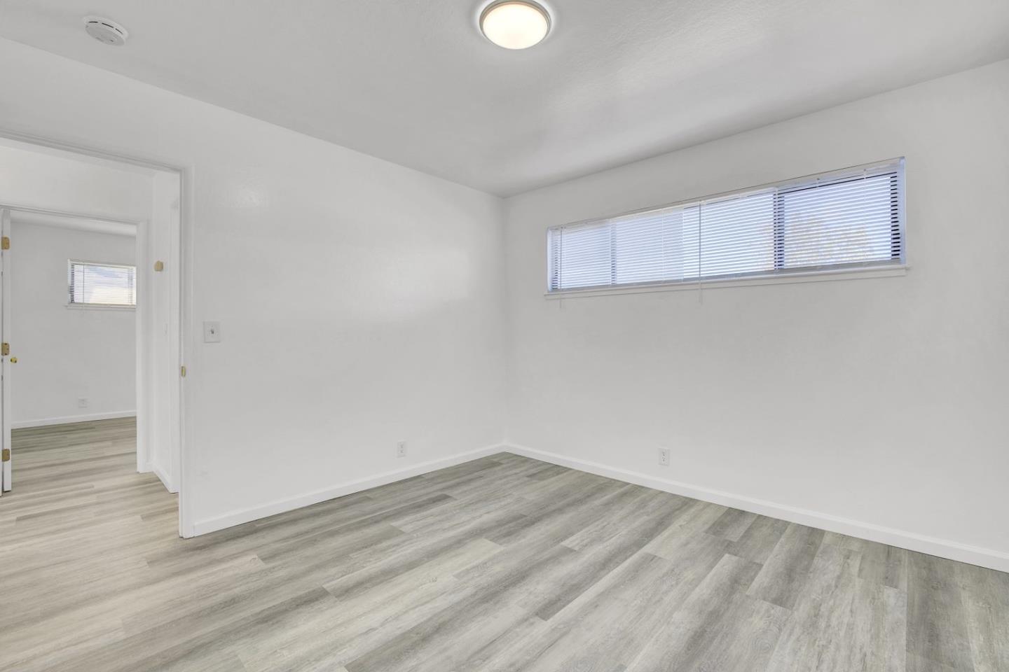 8811 A Street Oakland, CA 94621 - Photo 16 of 30 wooden floor in an empty room