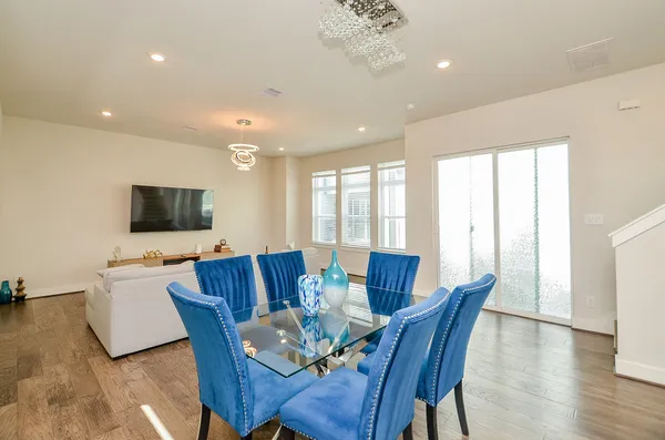 a view of a dining room with furniture window and wooden floor