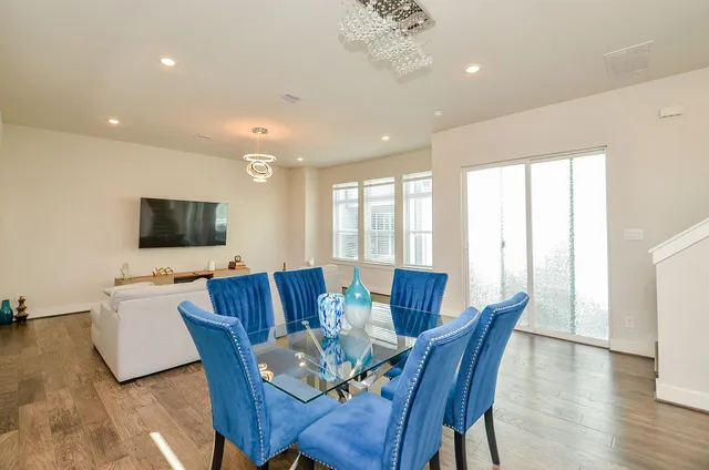 a view of a dining room with furniture window and wooden floor
