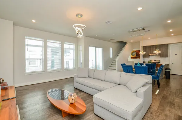a living room with furniture and a large window