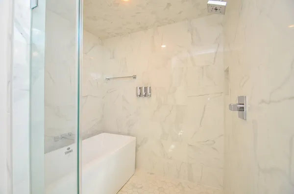 a bathroom with a white bath tub