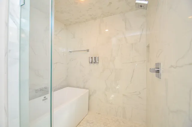 a bathroom with a white bath tub