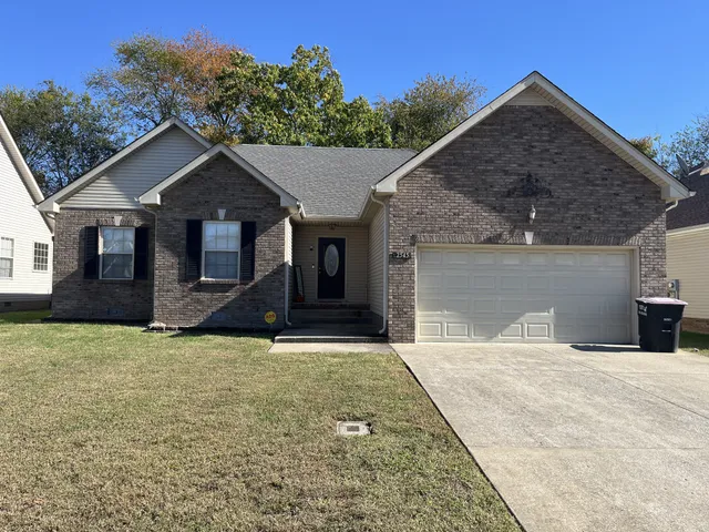 a front view of a house with yard