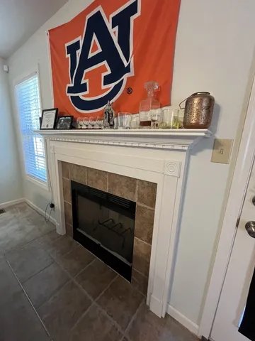 a living room with a fireplace and a stove
