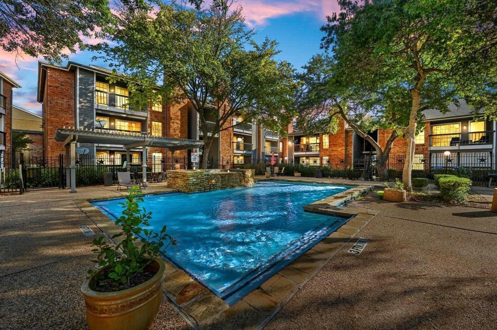 18333 Roehampton Drive, Unit 927 Dallas, TX 75252 - Photo 2 of 26 Community pool featuring a patio