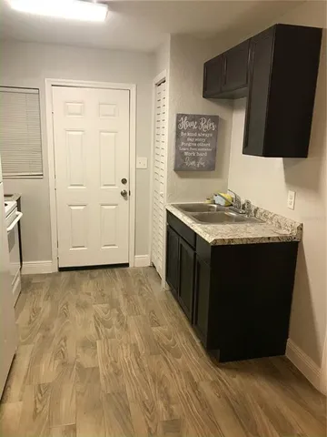 a bathroom with a sink toilet and mirror
