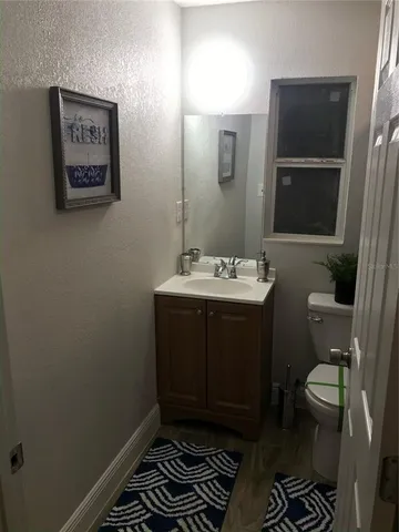 a close view of a bathroom with a shower and a toilet
