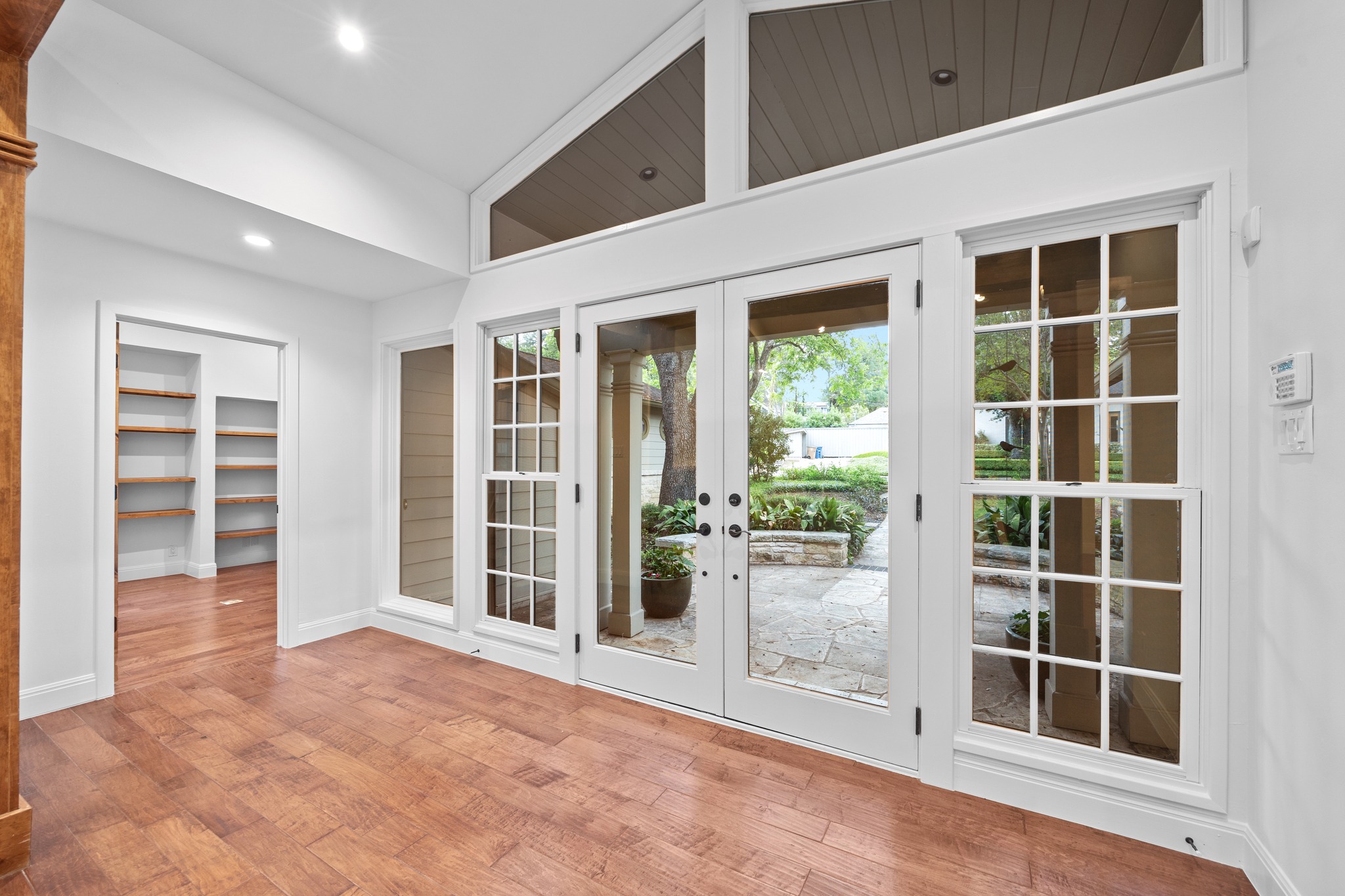 3205 Gilbert Street Austin, TX 78703 - Photo 14 of 35 French doors opening to a stone patio