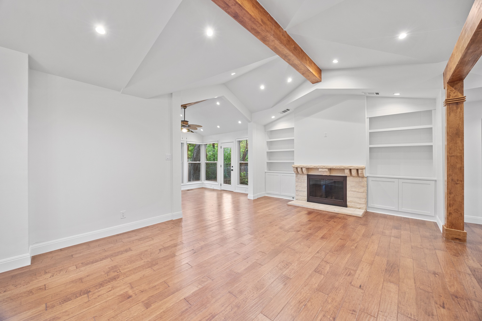3205 Gilbert Street Austin, TX 78703 - Photo 17 of 35 Spacious living area featuring wood-finish flooring, vaulted ceilings with exposed wood beams, and recessed lighting