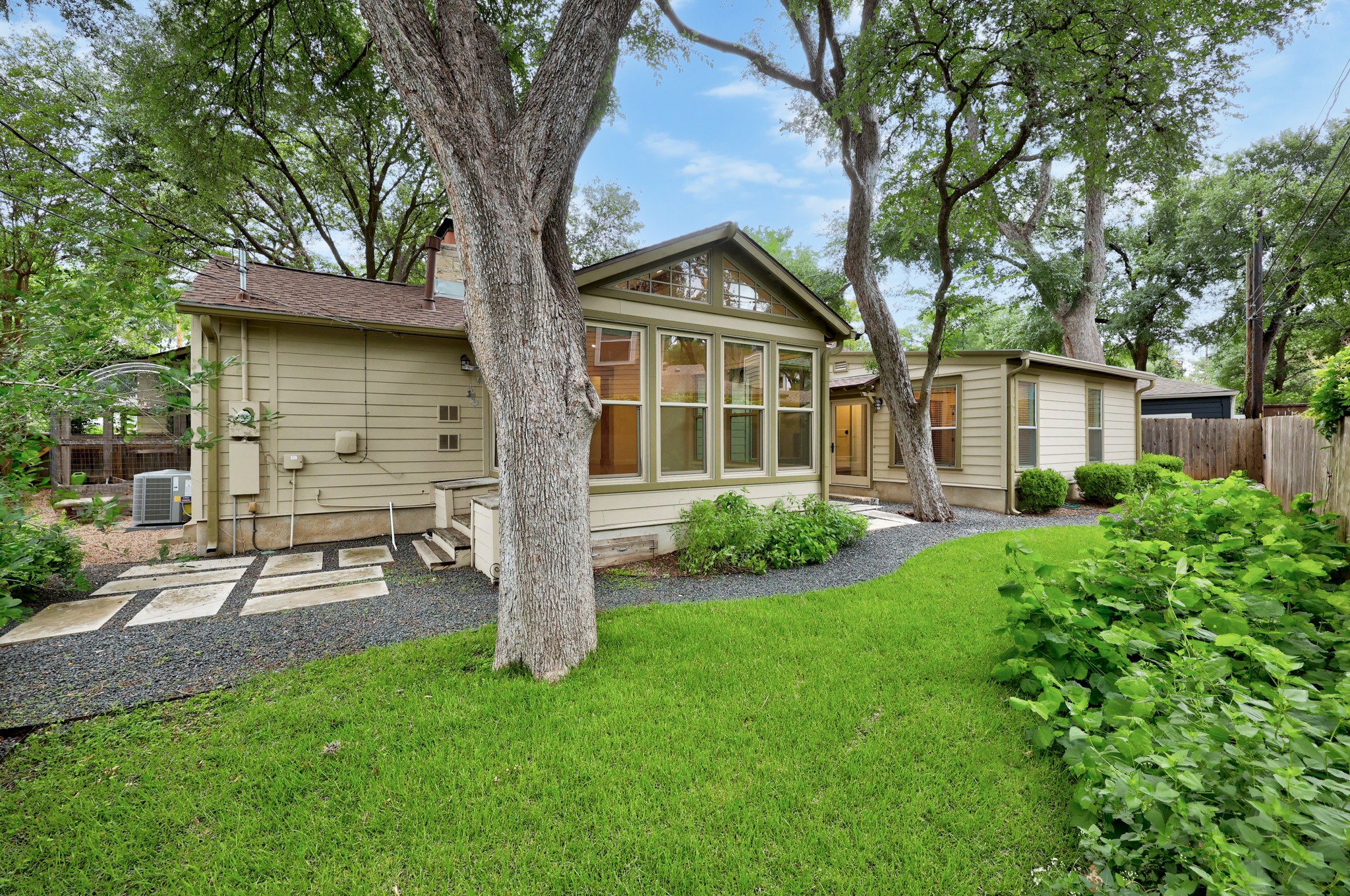 3205 Gilbert Street Austin, TX 78703 - Photo 31 of 35 Expansive green lawn with mature trees and a gravel pathway