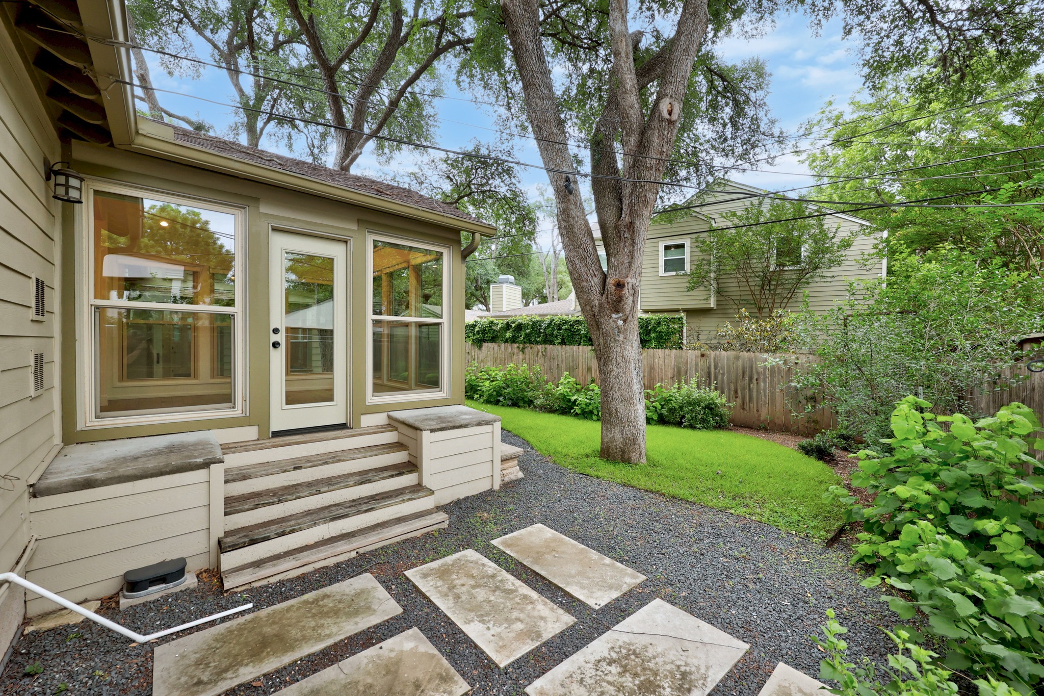 3205 Gilbert Street Austin, TX 78703 - Photo 32 of 35 Exterior siding in a neutral tone with a covered patio area