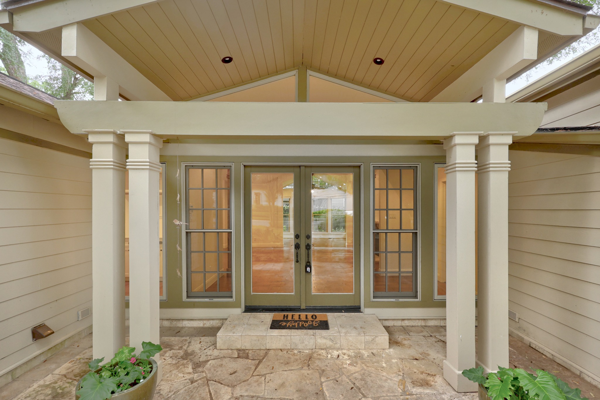 3205 Gilbert Street Austin, TX 78703 - Photo 4 of 35 Covered entry with flagstone flooring, flanked by decorative columns