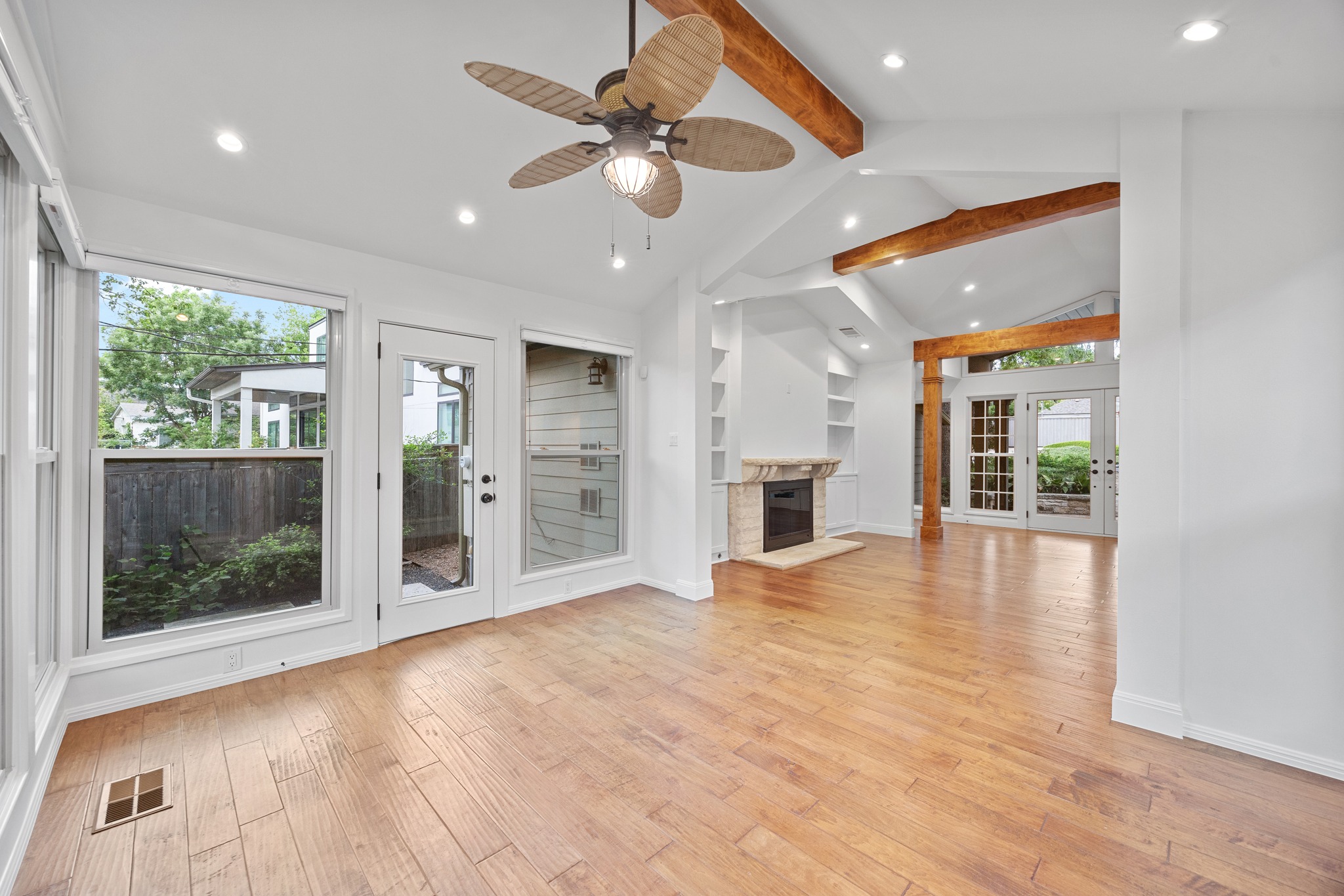 3205 Gilbert Street Austin, TX 78703 - Photo 6 of 35 Spacious living area featuring wood-finish flooring, vaulted ceilings with exposed wood beams, and recessed lighting