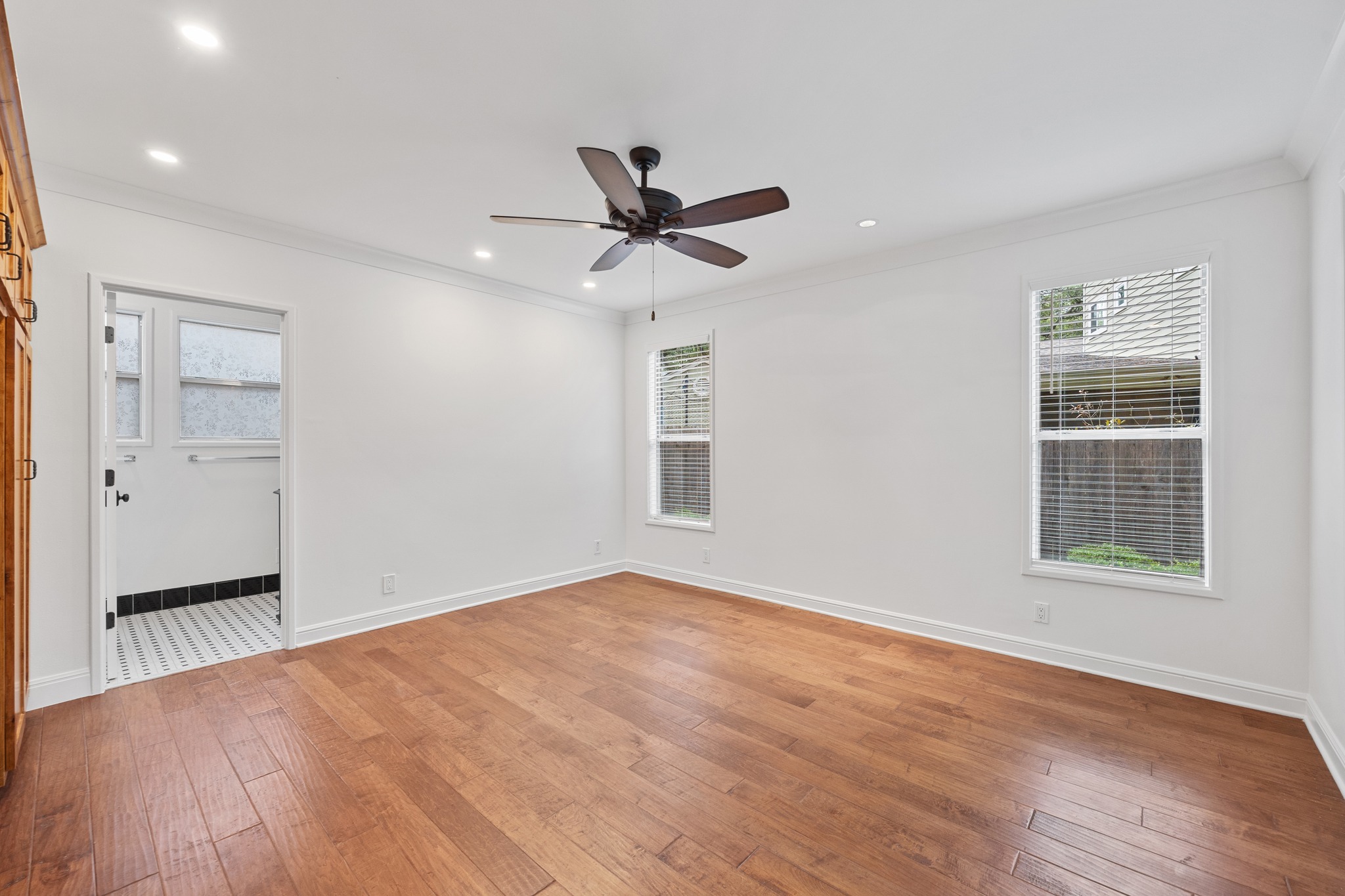 3205 Gilbert Street Austin, TX 78703 - Photo 10 of 35 Spacious room featuring wood-finish flooring, recessed lighting, and a ceiling fan