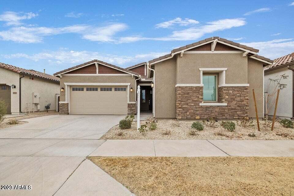 9749 East Tahoe Avenue, Unit 2 Mesa, AZ 85212 - Photo 1 of 25 a front view of a house with a yard