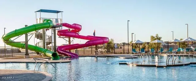 a view of swimming pool with outdoor seating