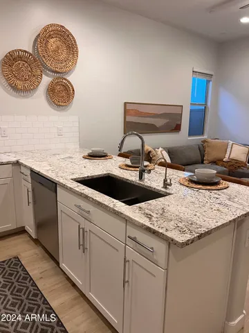 a kitchen with a sink and a stove