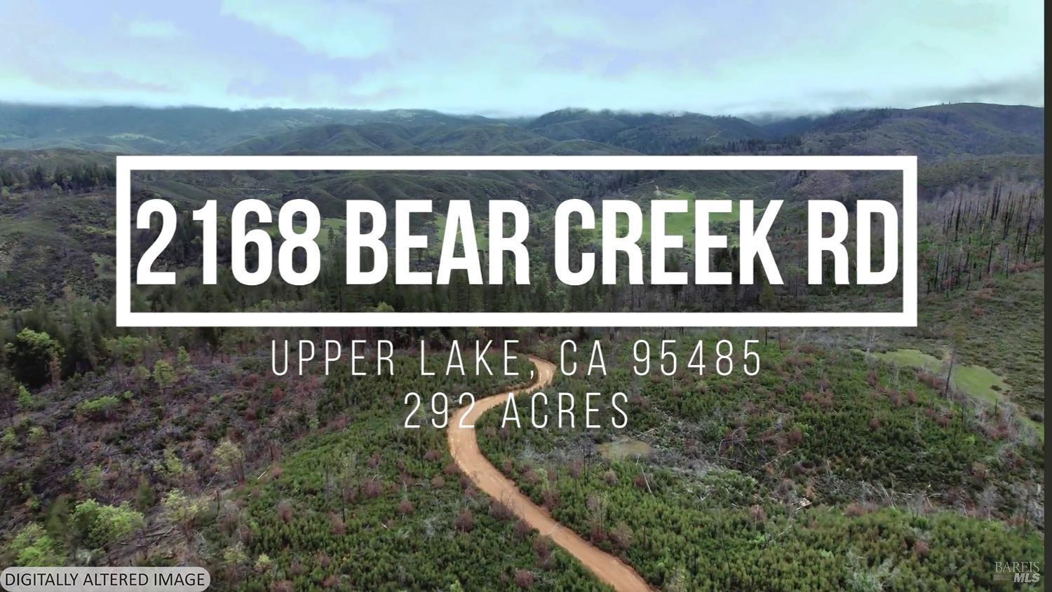 2168 Bear Creek Road Upper Lake, CA 95485 - Photo 1 of 16 a street sign that is on a wooden wall