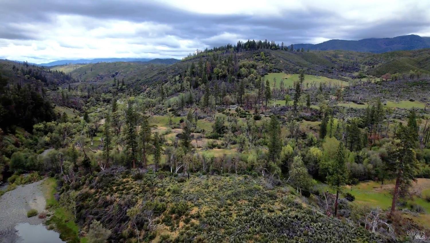 2168 Bear Creek Road Upper Lake, CA 95485 - Photo 11 of 16 a view of a city with mountains in the background