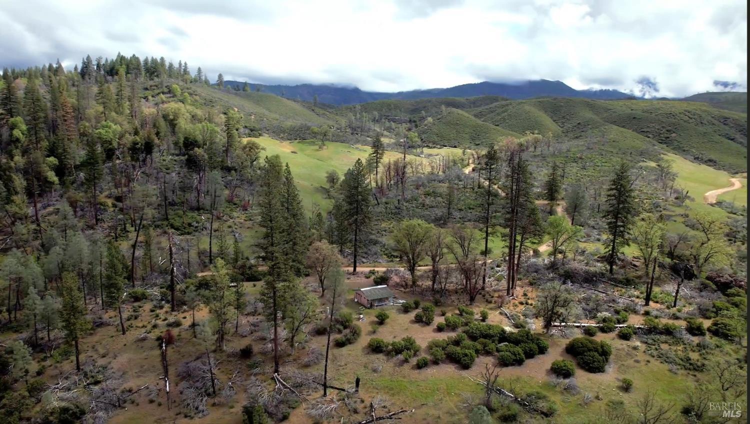 2168 Bear Creek Road Upper Lake, CA 95485 - Photo 2 of 16 a view of a town with mountains in the background