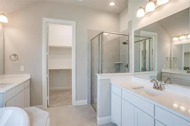 a bathroom with a sink double vanity and a mirror
