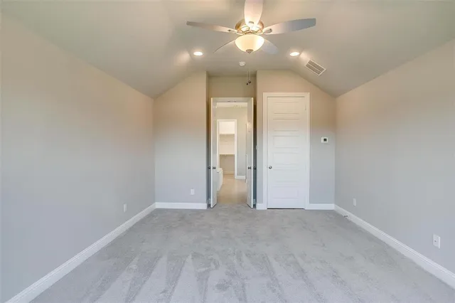 a view of an house with backyard space and balcony