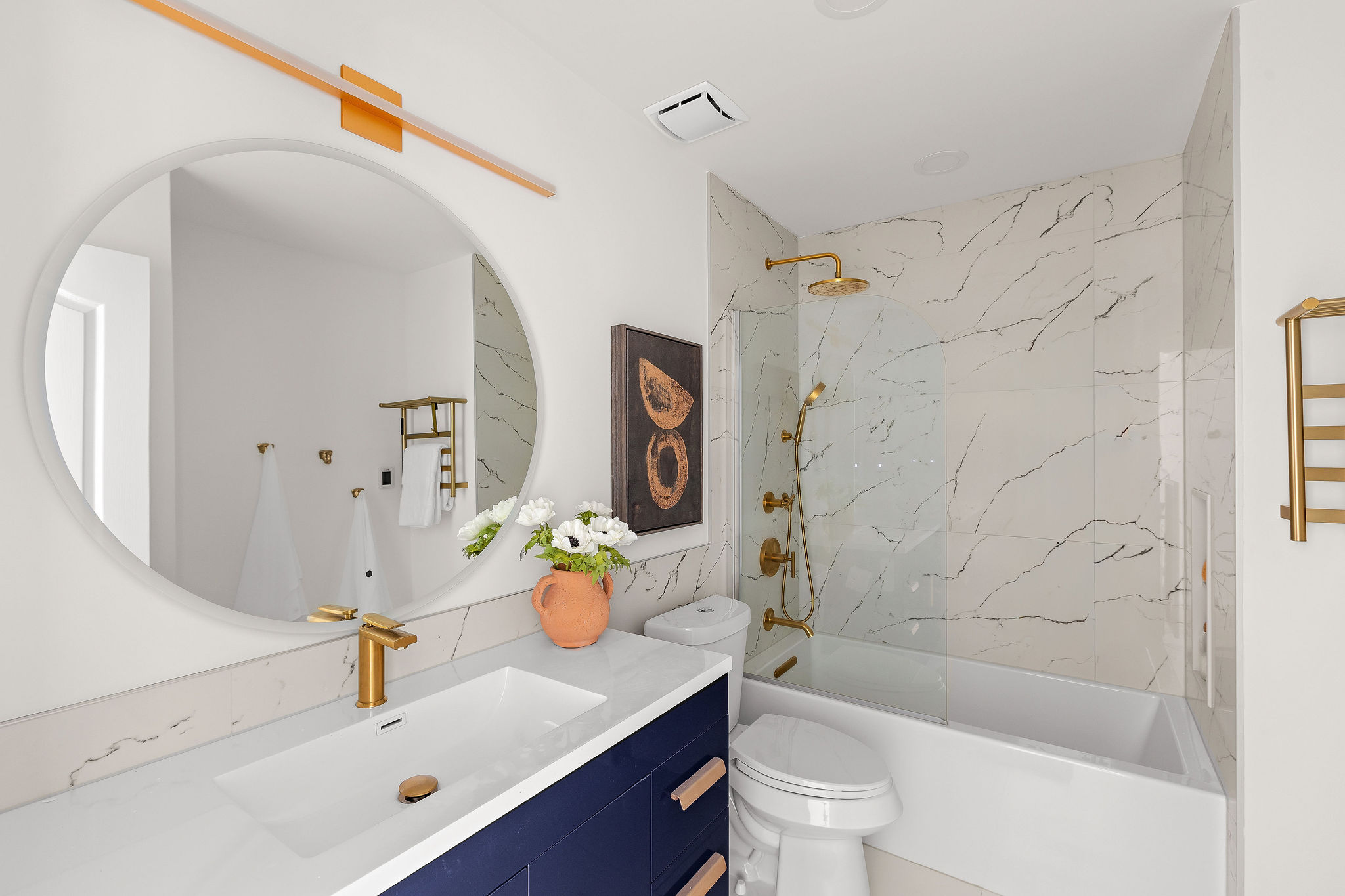 6500 Clay Allison Pass Austin, TX 78749 - Photo 31 of 39 Bathroom featuring a deep blue vanity with gold hardware, a rectangular undermount sink, and a white countertop
