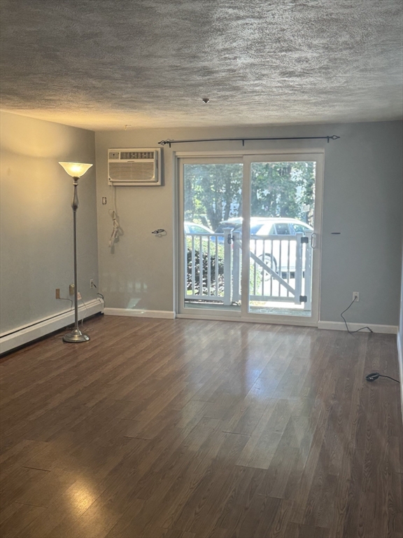 7 Karen Circle, Unit 2 Billerica, MA 01821 - Photo 4 of 11 a view of an empty room with a window