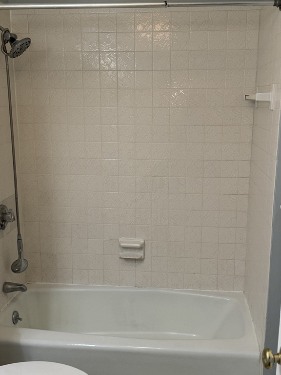 7 Karen Circle, Unit 2 Billerica, MA 01821 - Photo 10 of 11 a bathroom with a bathtub