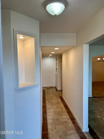 a view of room with window and ceiling fan