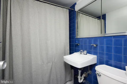 a balcony with wooden benches