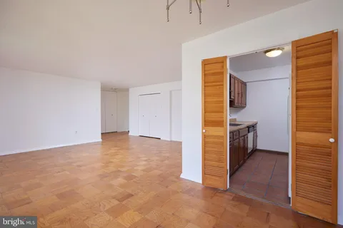 a kitchen with stainless steel appliances granite countertop a sink and a microwave oven