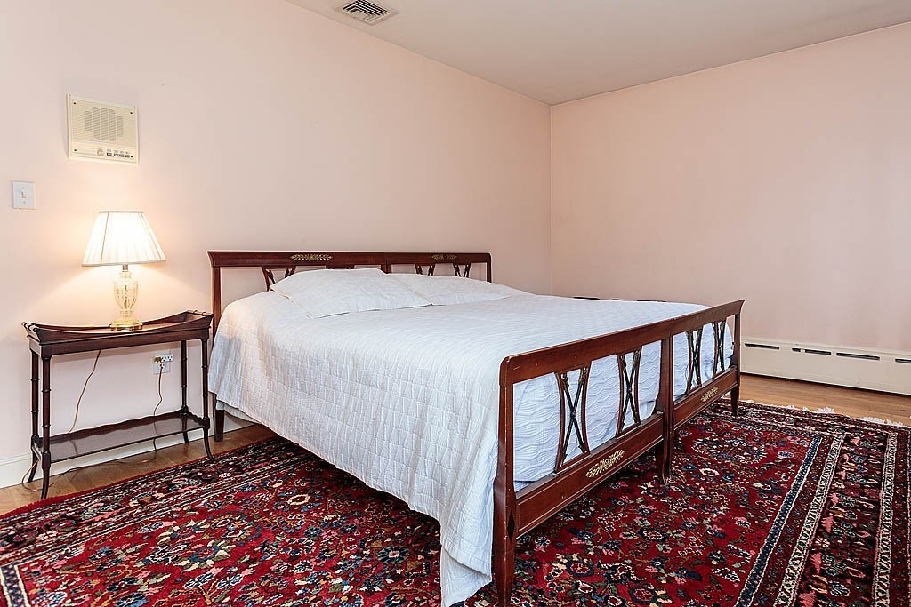 11 Woodfall Road Belmont, MA 02478 - Photo 17 of 26 a bedroom with a bed and a window