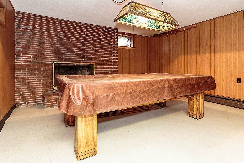11 Woodfall Road Belmont, MA 02478 - Photo 22 of 26 a bed sitting in a room next to a window