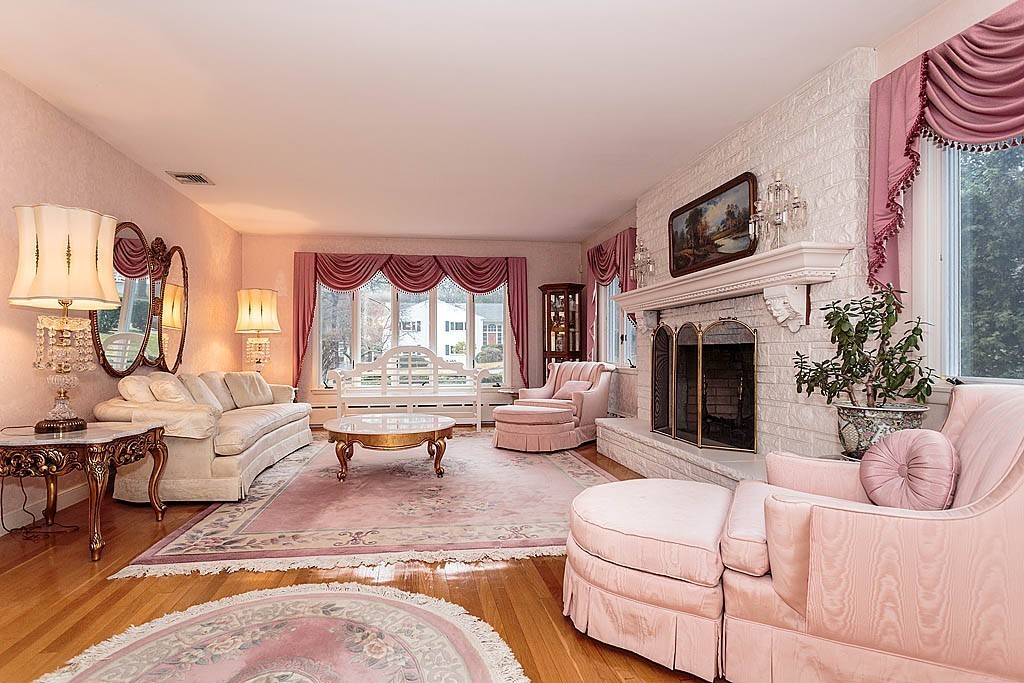 11 Woodfall Road Belmont, MA 02478 - Photo 3 of 26 a living room with furniture large window and a fireplace