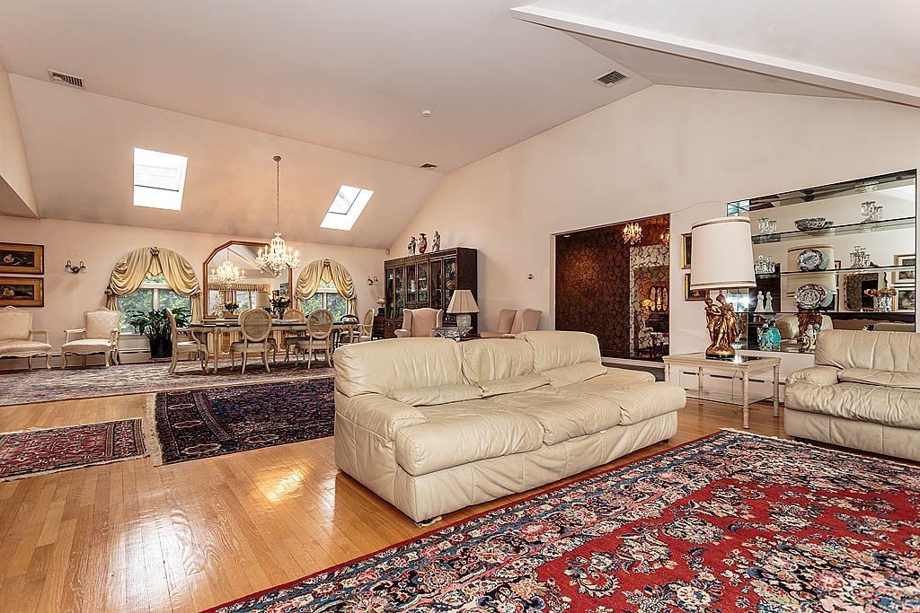 11 Woodfall Road Belmont, MA 02478 - Photo 7 of 26 a large bedroom with a large bed and a view of living room