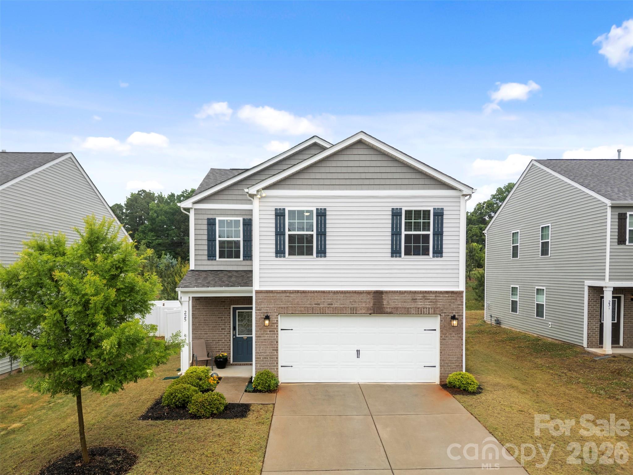 225 Final Stretch Lane Clover, SC 29710 - Photo 2 of 39 a front view of a house with a yard