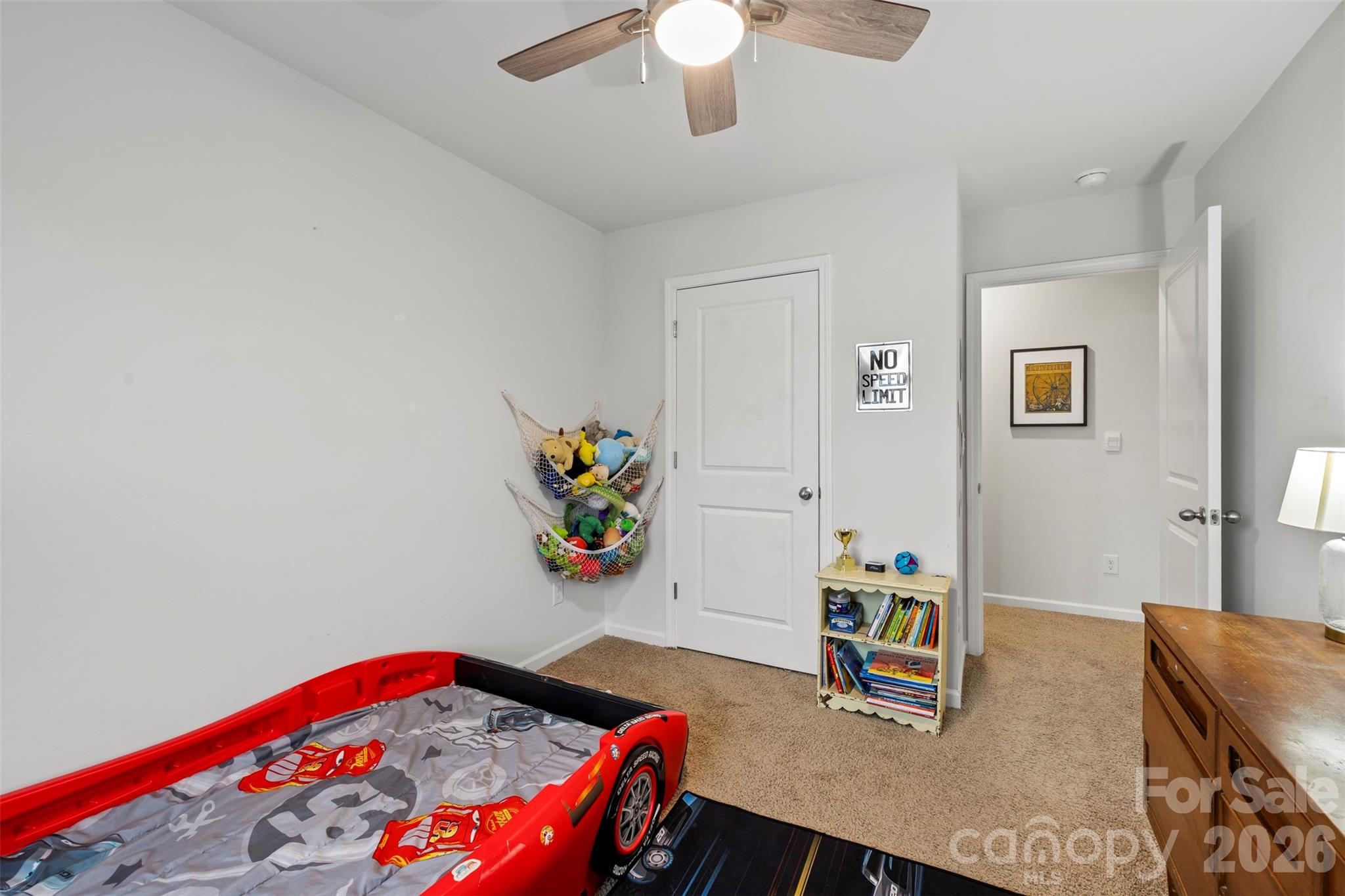 225 Final Stretch Lane Clover, SC 29710 - Photo 28 of 39 a bedroom with a bed and a chandelier