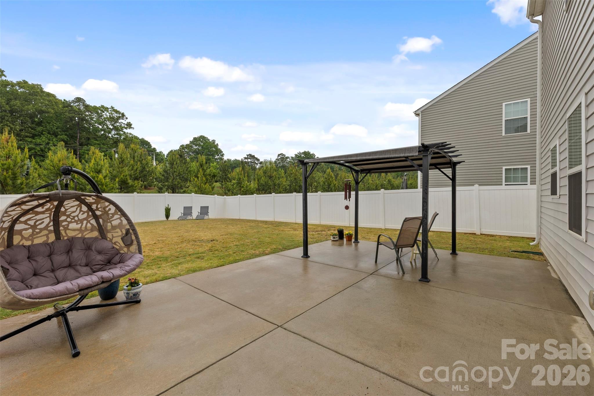 225 Final Stretch Lane Clover, SC 29710 - Photo 33 of 39 a view of a swimming pool with a lounge chairs