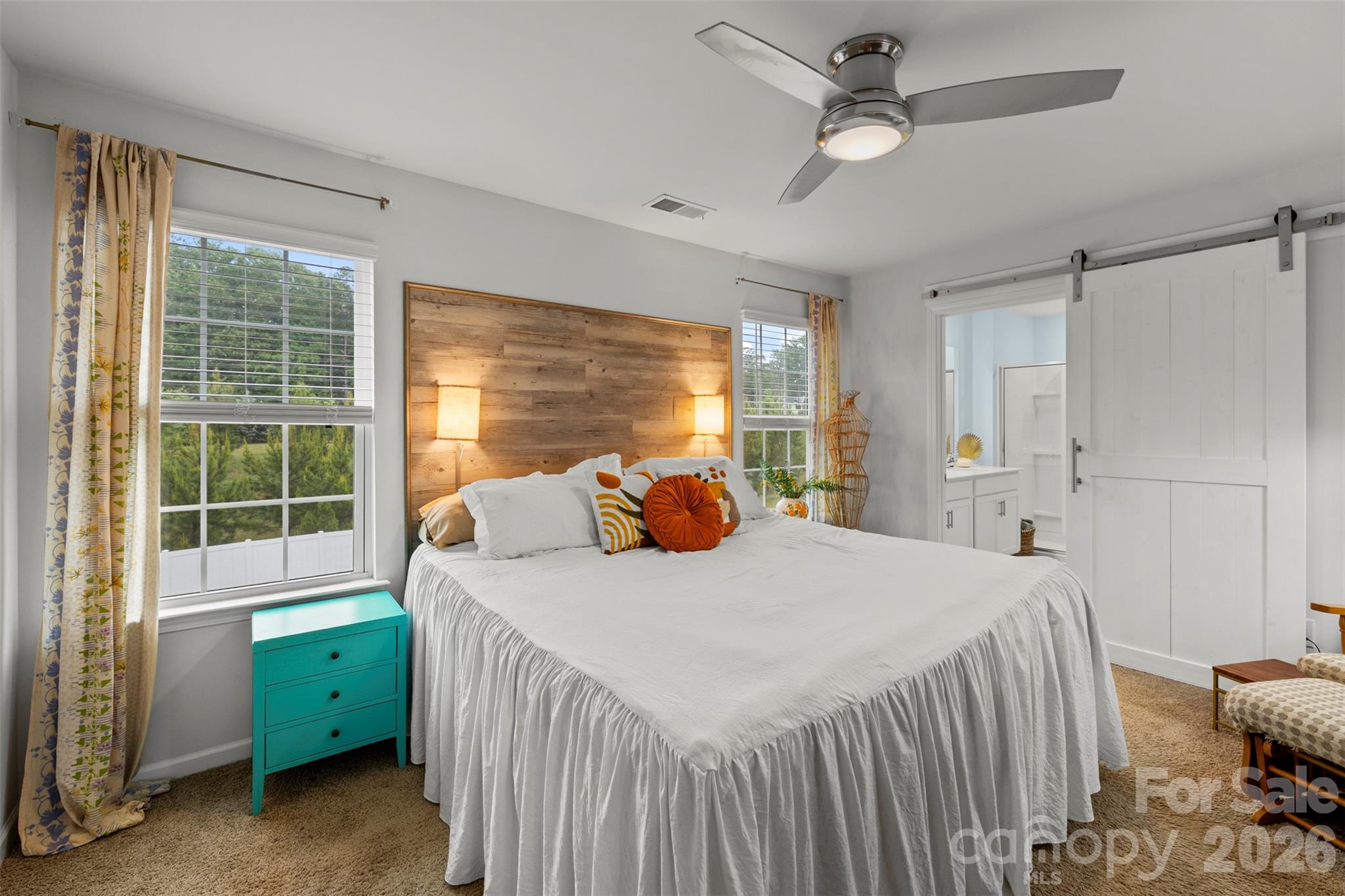 225 Final Stretch Lane Clover, SC 29710 - Photo 6 of 39 a bedroom with a bed and a large window