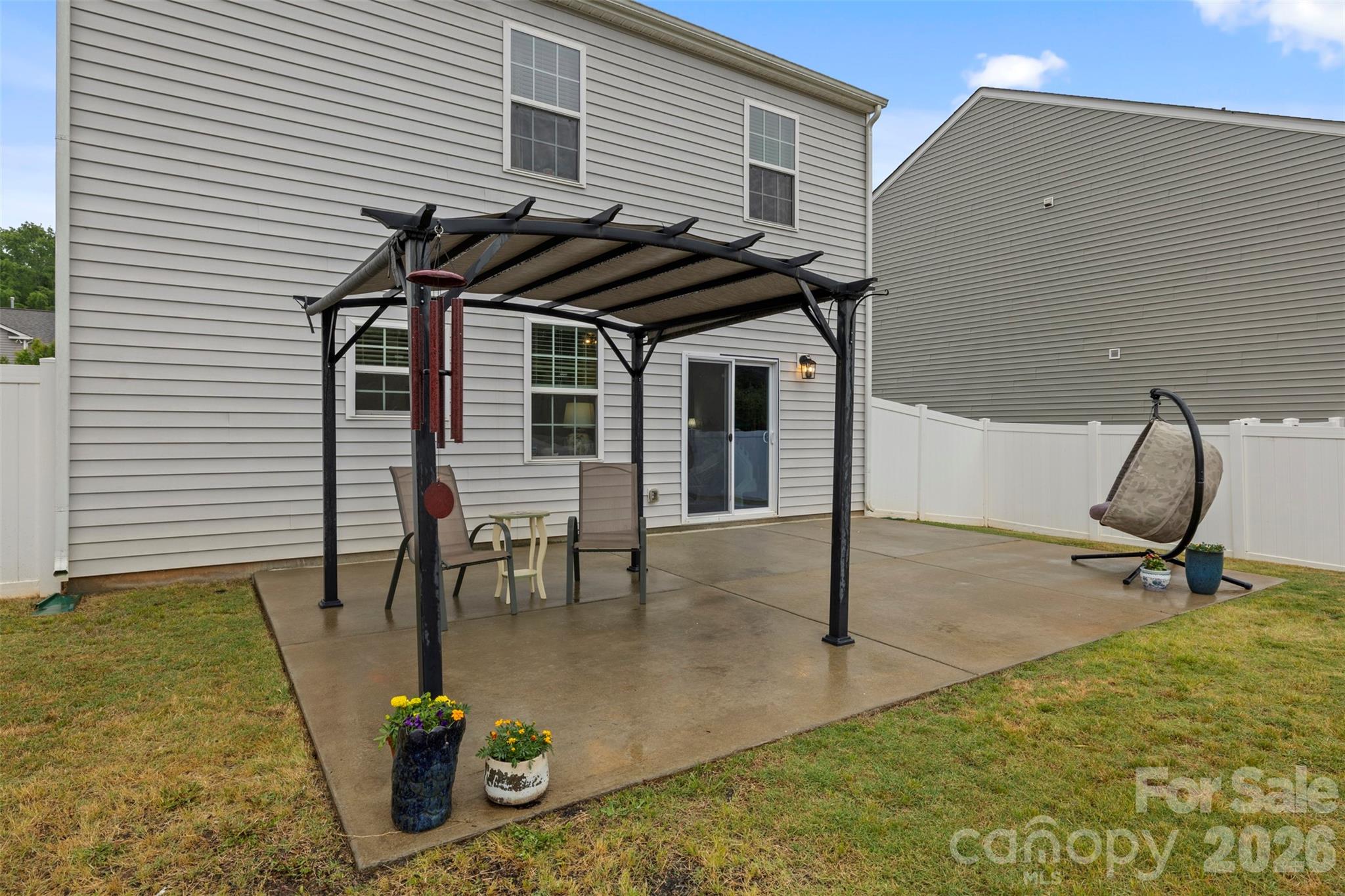 225 Final Stretch Lane Clover, SC 29710 - Photo 7 of 39 a view of a patio with table and chairs