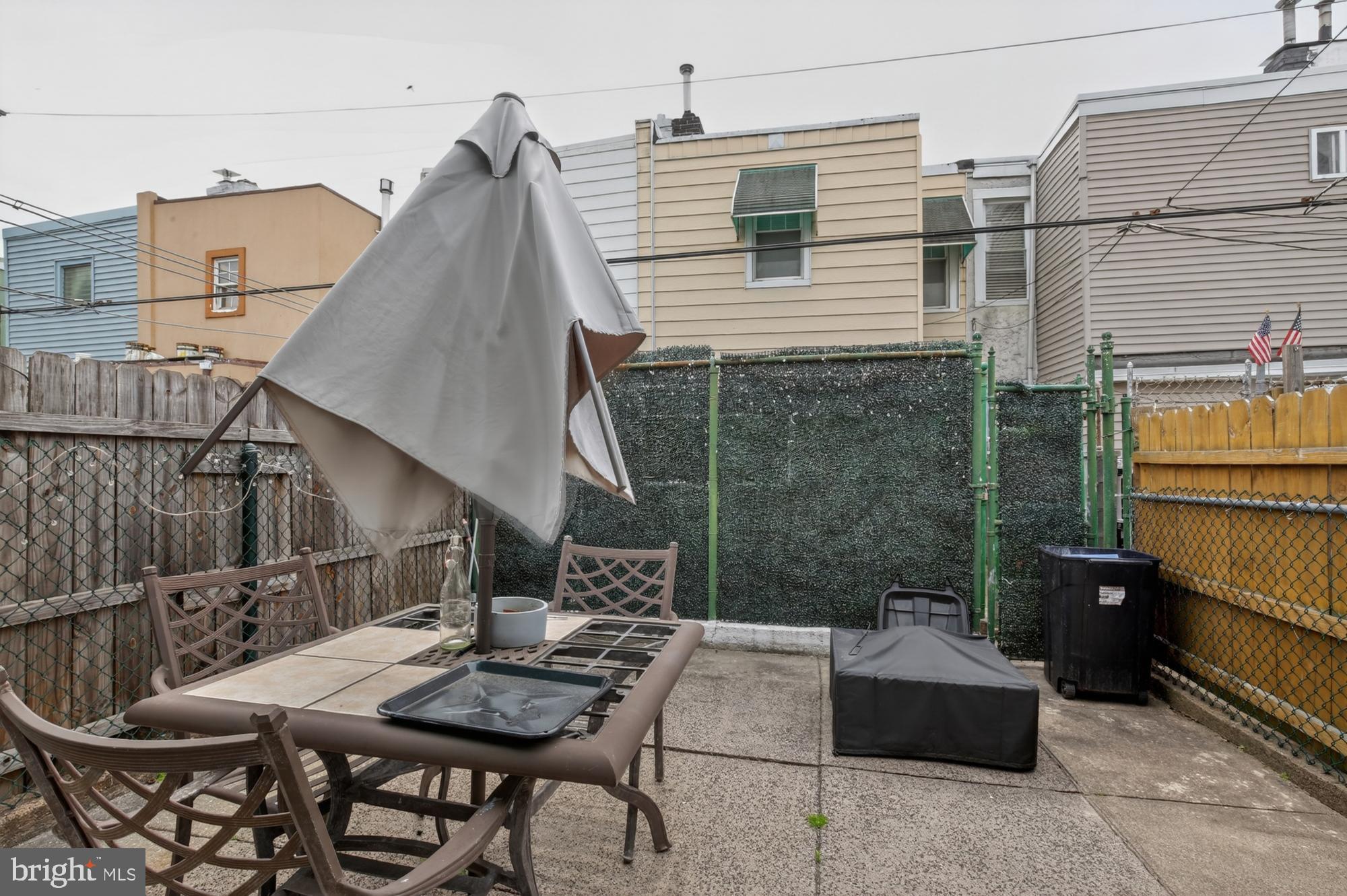 3147 Edgemont Street Philadelphia, PA 19134 - Photo 11 of 23 a view of backyard with outdoor seating a patio and plants
