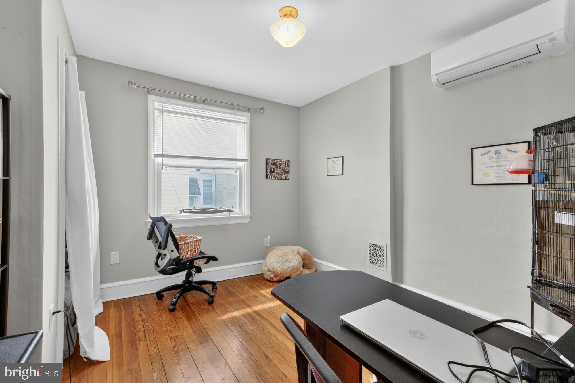 3147 Edgemont Street Philadelphia, PA 19134 - Photo 14 of 23 a workspace with furniture and a window