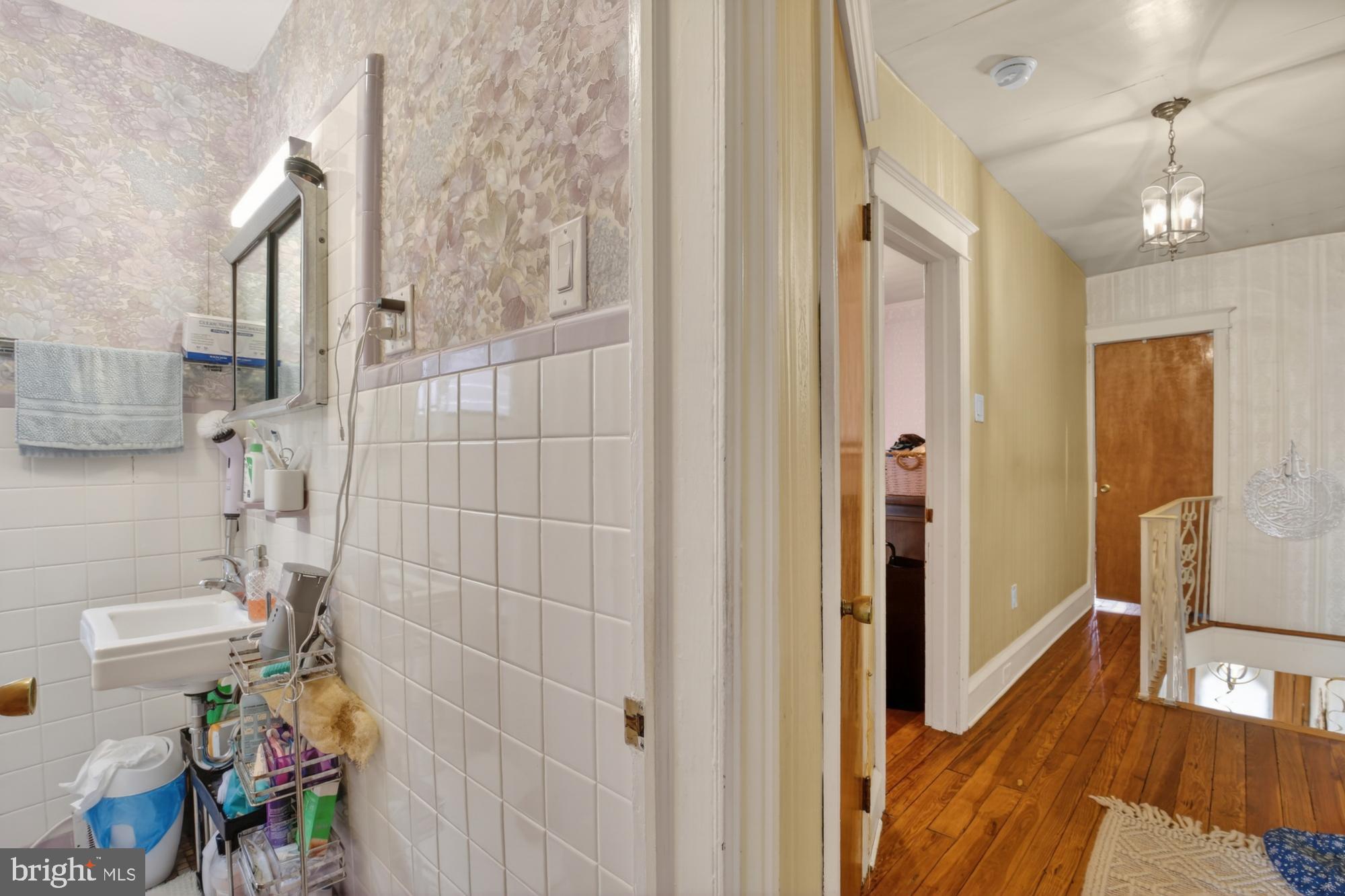 3147 Edgemont Street Philadelphia, PA 19134 - Photo 17 of 23 a bathroom with a bathtub and shower