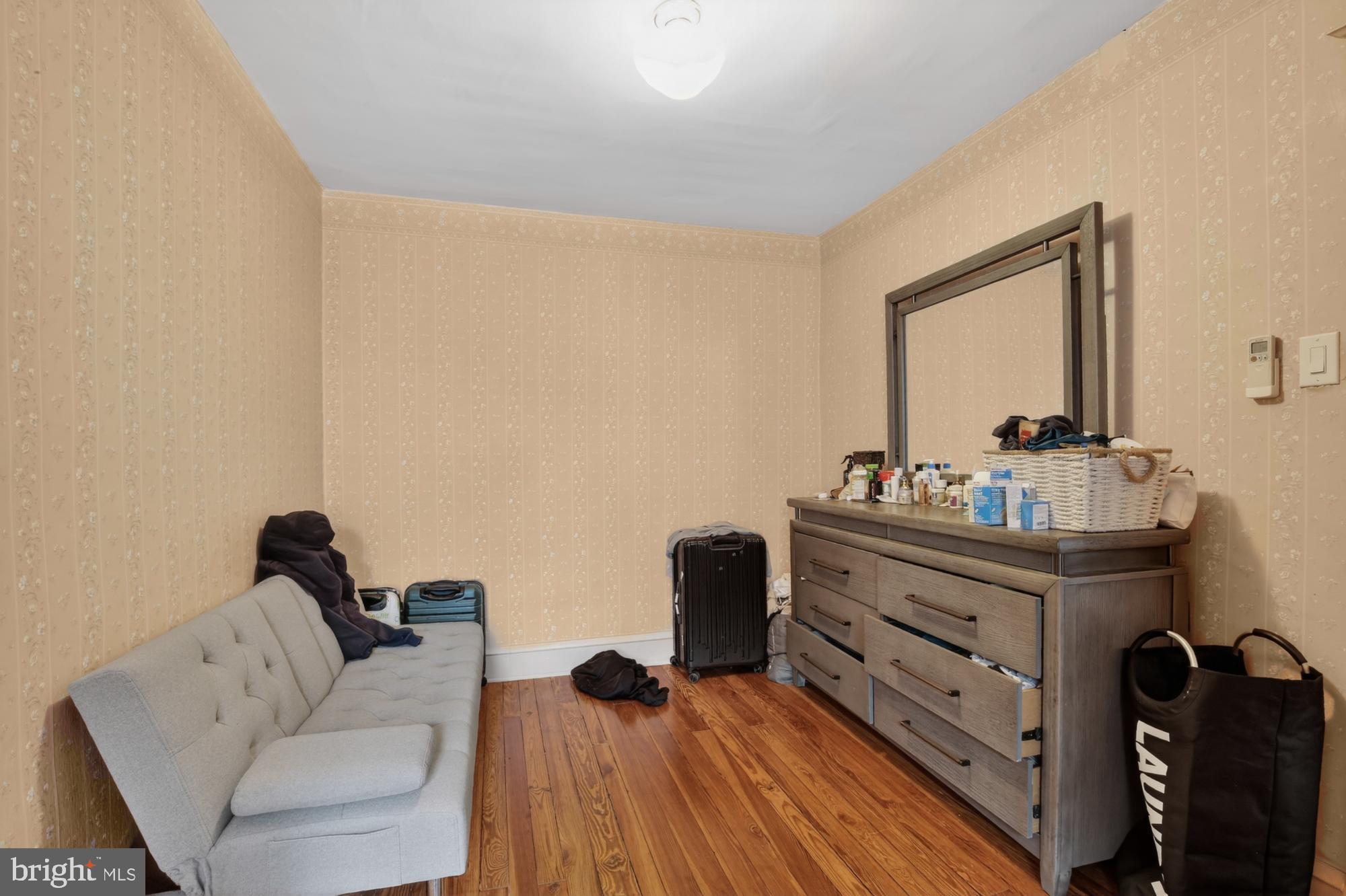 3147 Edgemont Street Philadelphia, PA 19134 - Photo 18 of 23 a living room with furniture and a mirror