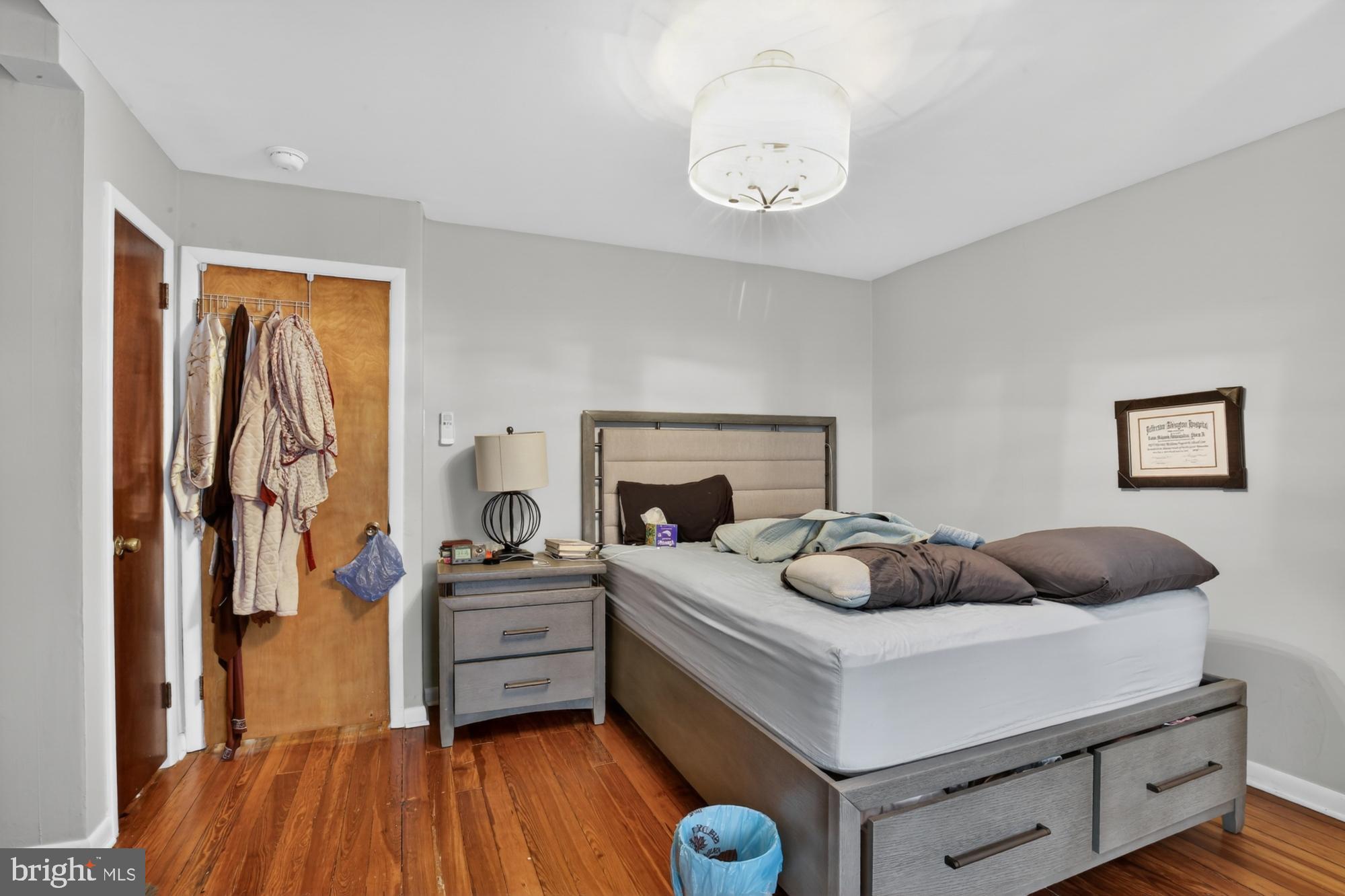 3147 Edgemont Street Philadelphia, PA 19134 - Photo 21 of 23 a bedroom with furniture and a fireplace