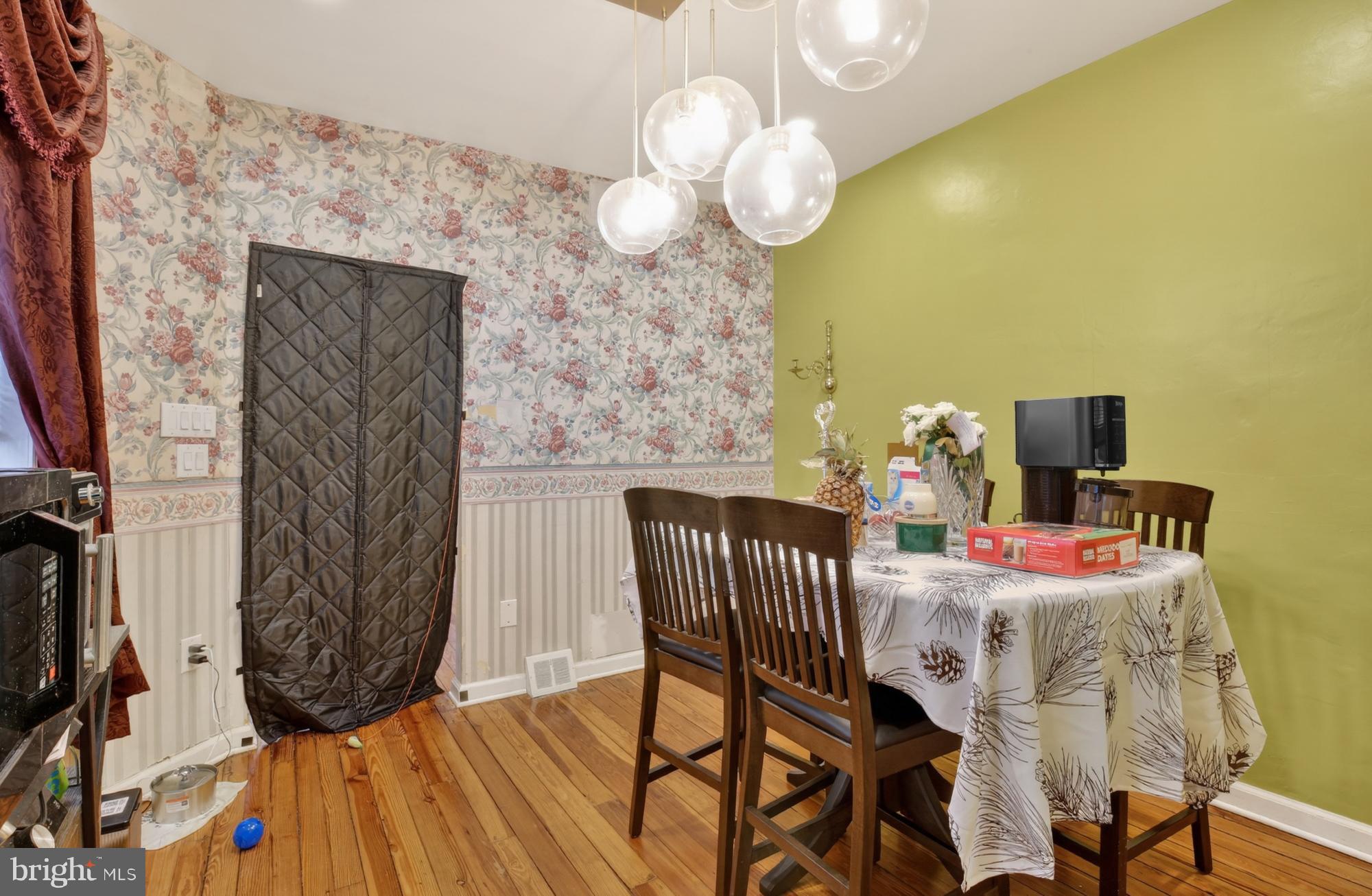 3147 Edgemont Street Philadelphia, PA 19134 - Photo 8 of 23 a view of a dining room with furniture and wooden floor