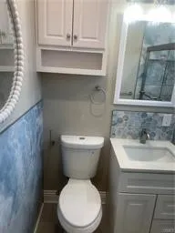a bathroom with a toilet and a sink