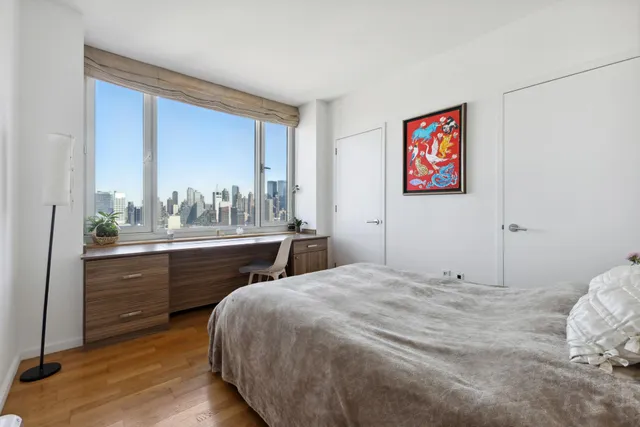 a room with lots of furniture and a chandelier