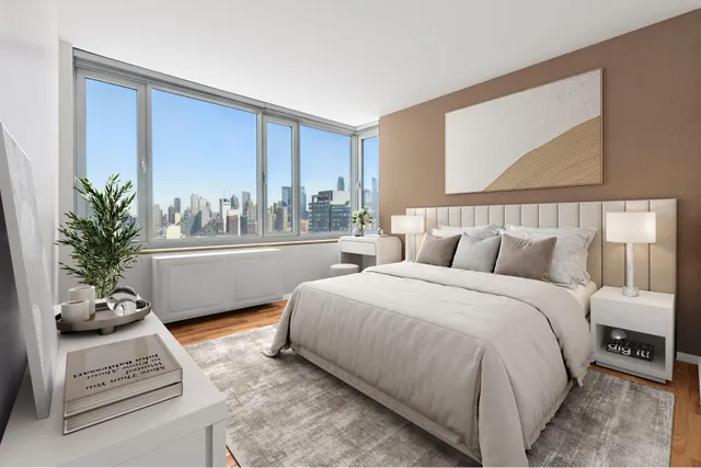 a bedroom with a large bed and a window